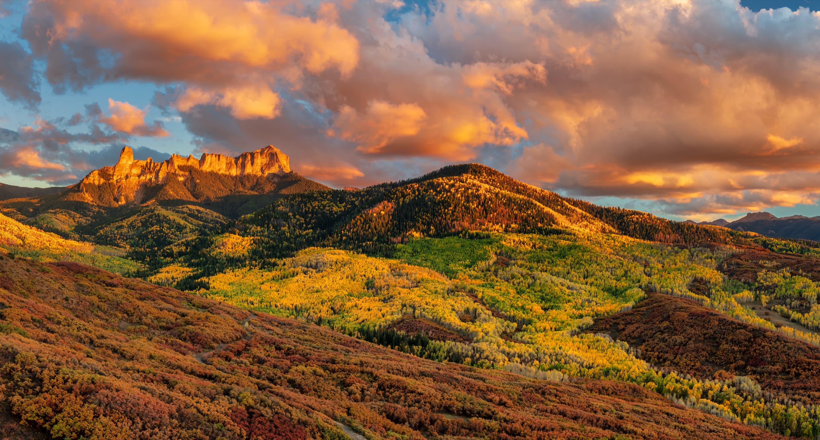 Sunset light on rolling autumn hills below a ridgeline
